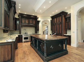 Kitchen with dark cabinetry